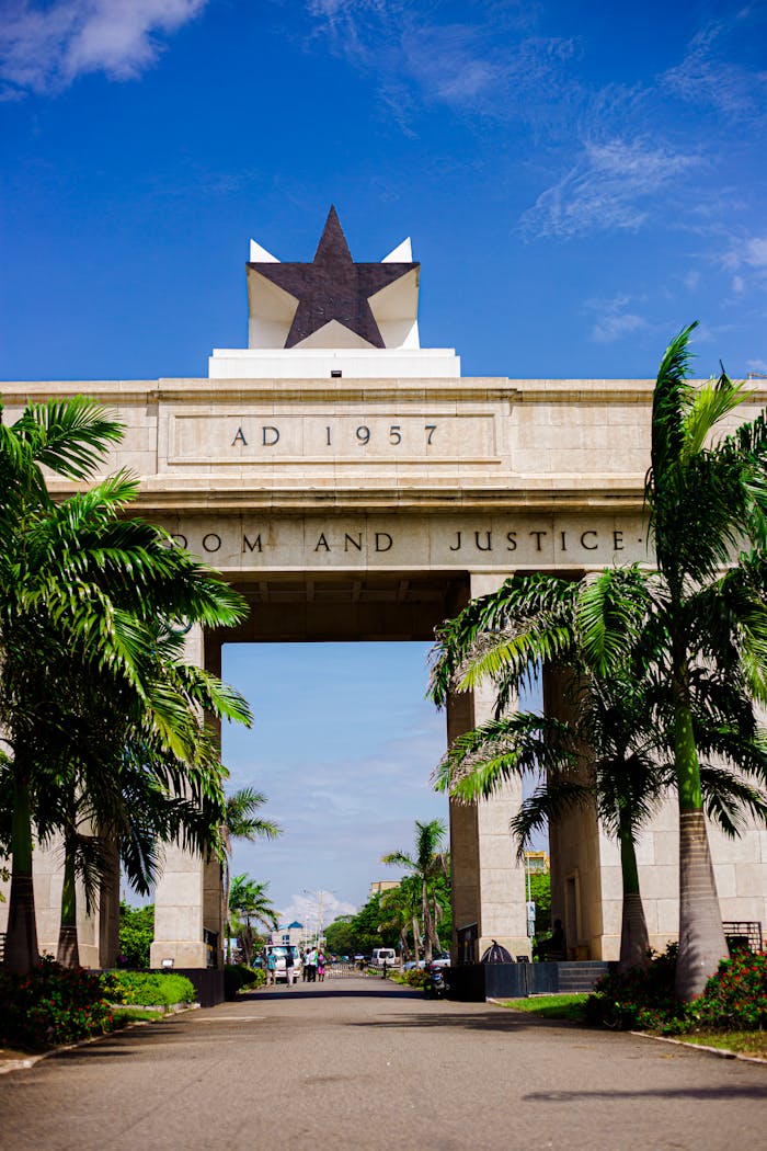 Iconic Black Star Gate under a clear blue sky in Accra, symbolizing Ghana's freedom and justice.